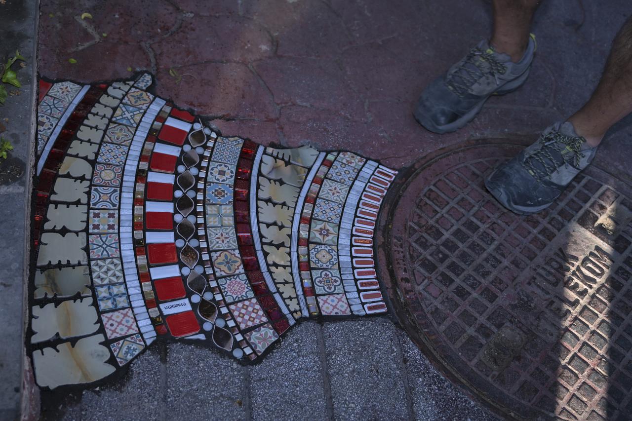 Famed French anonymous street artist Ememem created a mosaic installation on a sidewalk along Paris Street, where the French Embassy in Ankara is located, Türkiye, June 25, 2025. (AA Photo)