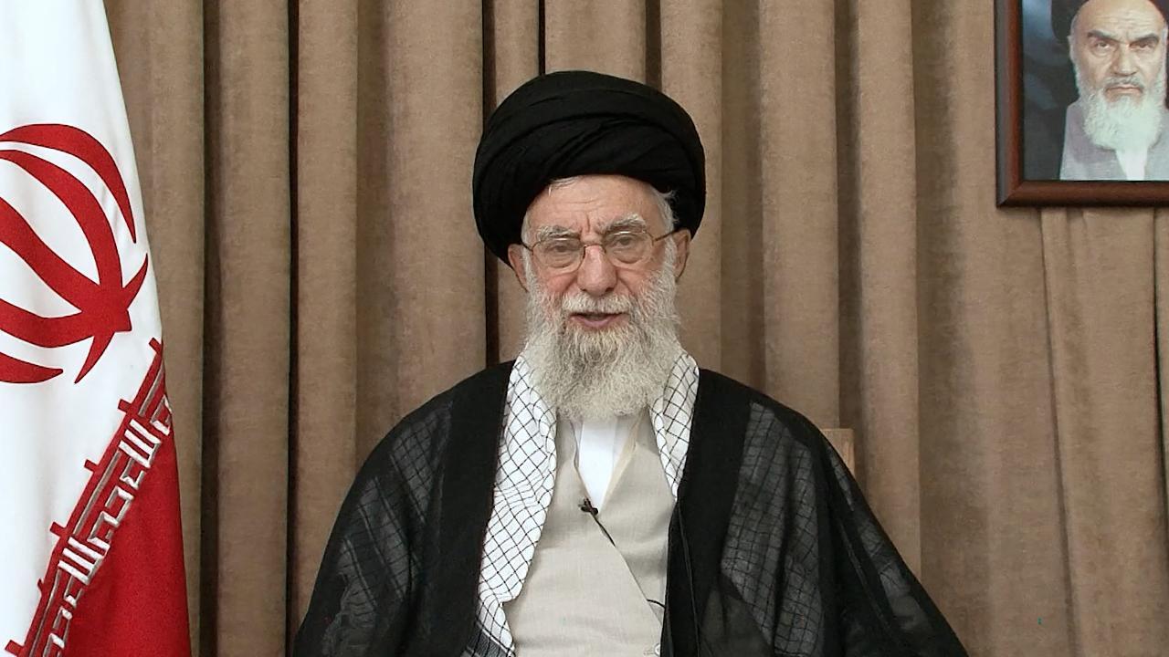 This image released by the office of Irans supreme leader, Ayatollah Ali Khamenei, on June 26, 2025 shows him addressing the nation in front of a portrait of his predecessor, the late founder of the Islamic republic Ayatollah Ruhollah Khomeini. (Photo by KHAMENEI.IR / AFP)