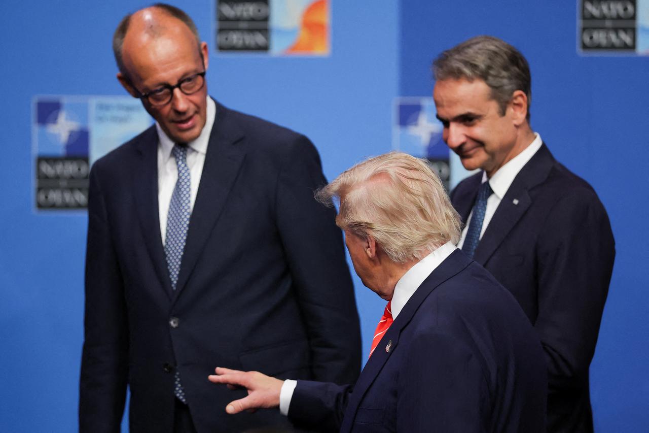US President Donald Trump (C) speaks with German Chancellor Friedrich Merz (L) and Greek Prime Minister Kyriakos Mitsotakis (R) as they gather for a family photo before a plenary session of the North Atlantic Treaty Organization (NATO) Heads of State and Government summit in The Hague, on June 25, 2025. (AFP Photo)