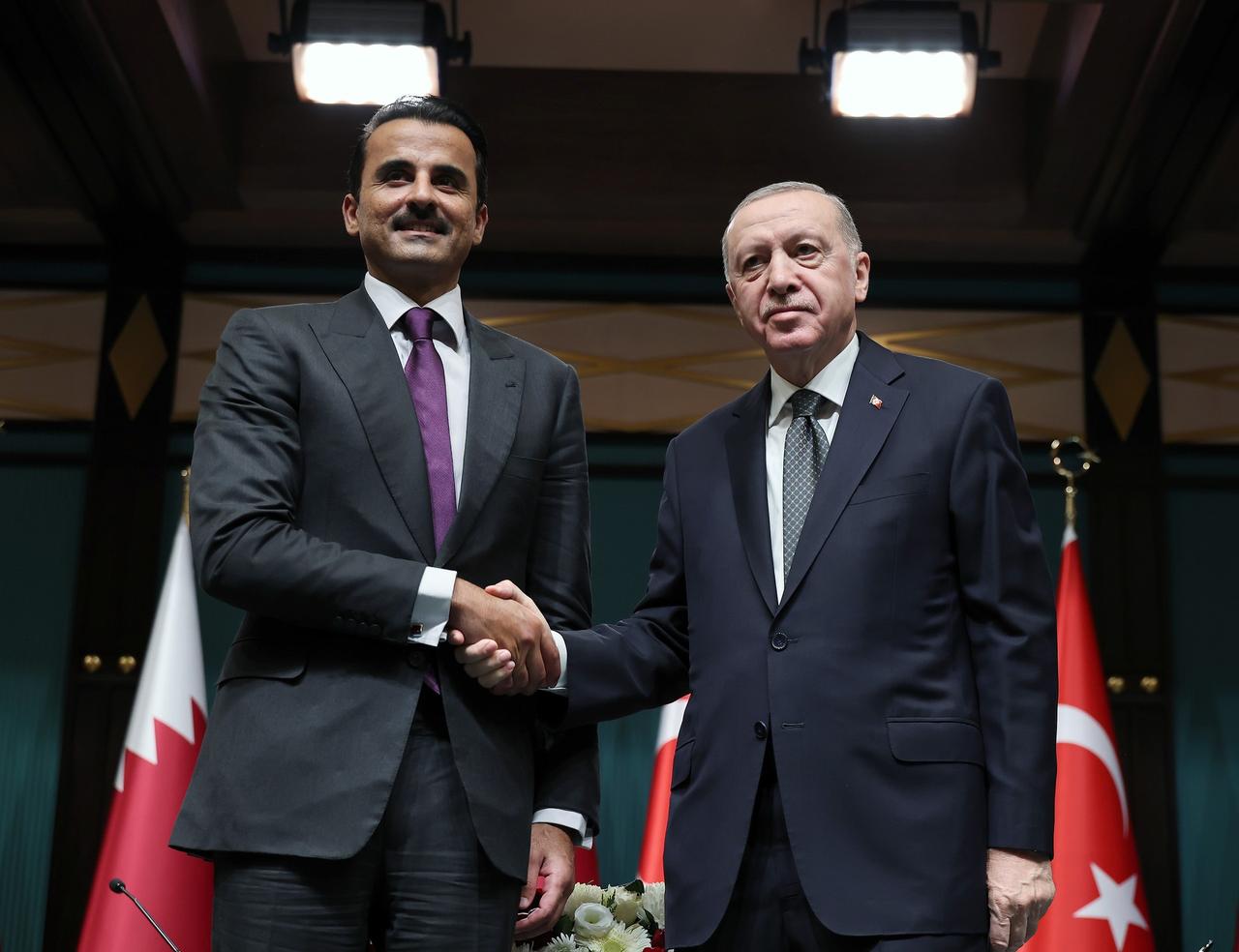 Turkish President Recep Tayyip Erdogan (R) shakes hands with Emir of Qatar Sheikh Tamim bin Hamad Al Thani (L) as they pose for a photo as they chair the “Tenth Meeting of the Turkiye-Qatar High Strategic Committee” at the Presidential Complex in Ankara, Türkiye on November 14, 2024. (Turkish Presidency / AA Photo)