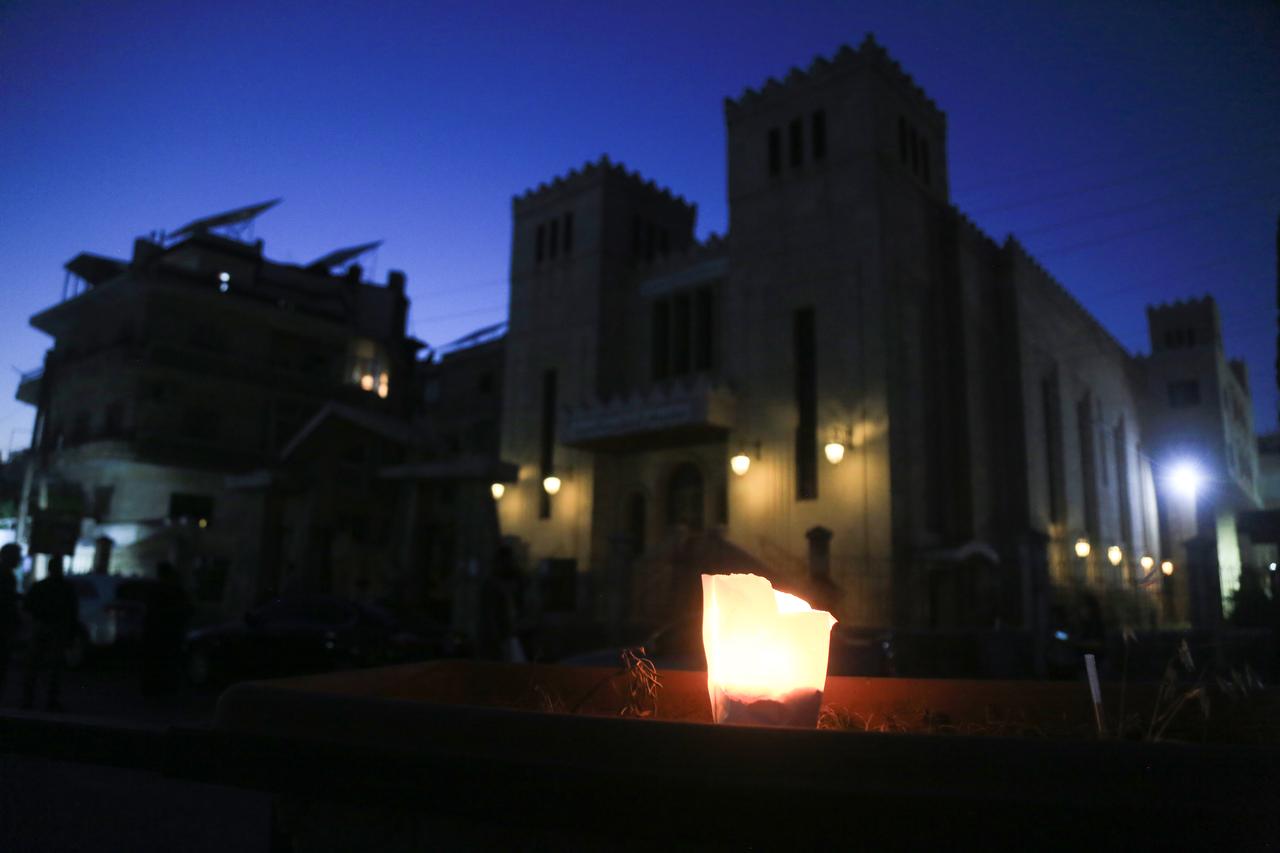 People from different religions gather for candlelight vigil to pay tribute to the victims of Mar Elias Church terror attack, in Aleppo, Syria June 23, 2025. (AA Photo)