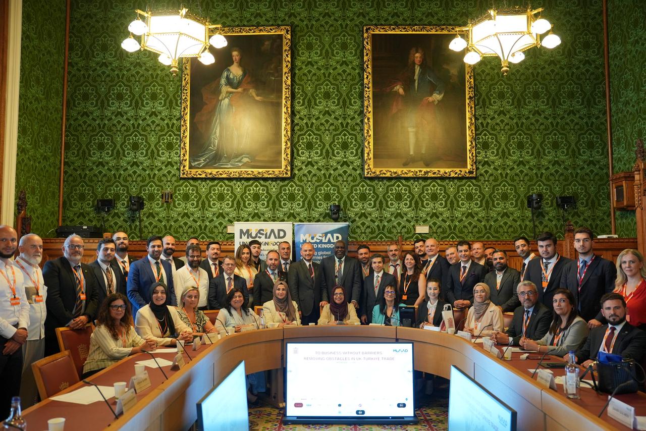 Participants pose for a group photo during the “Business Without Barriers: Removing Obstacles in UK–Türkiye Trade” roundtable, hosted by MUSIAD UK at the House of Lords in London, United Kingdom, June 25, 2025. (AA Photo)