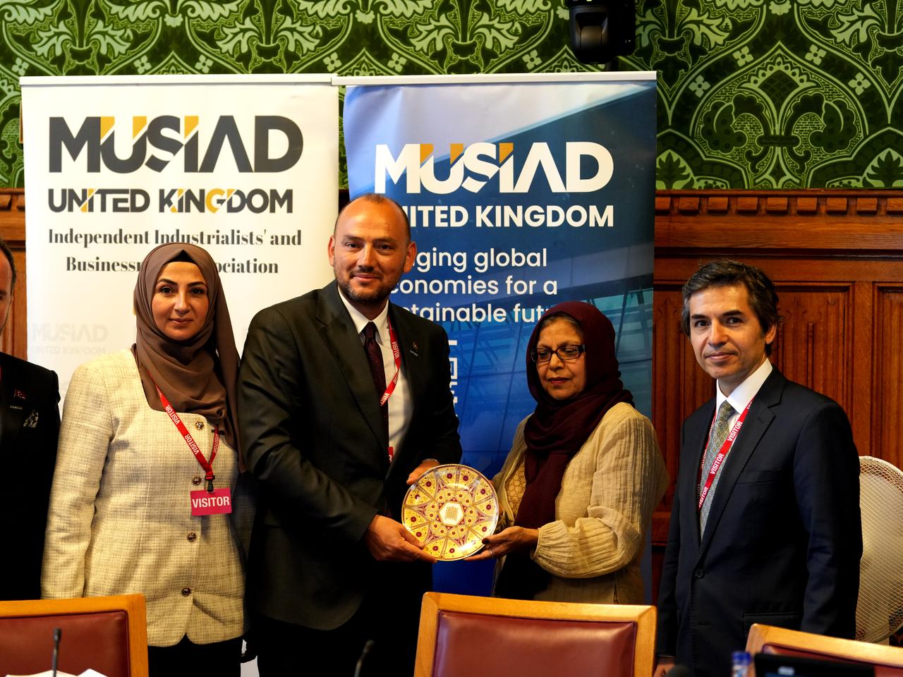 MUSIAD UK officials present a commemorative plate to Baroness Uddin during a bilateral trade roundtable at the House of Lords in London, highlighting deepening economic ties between Türkiye and the UK, June 25, 2025. (AA Photo)