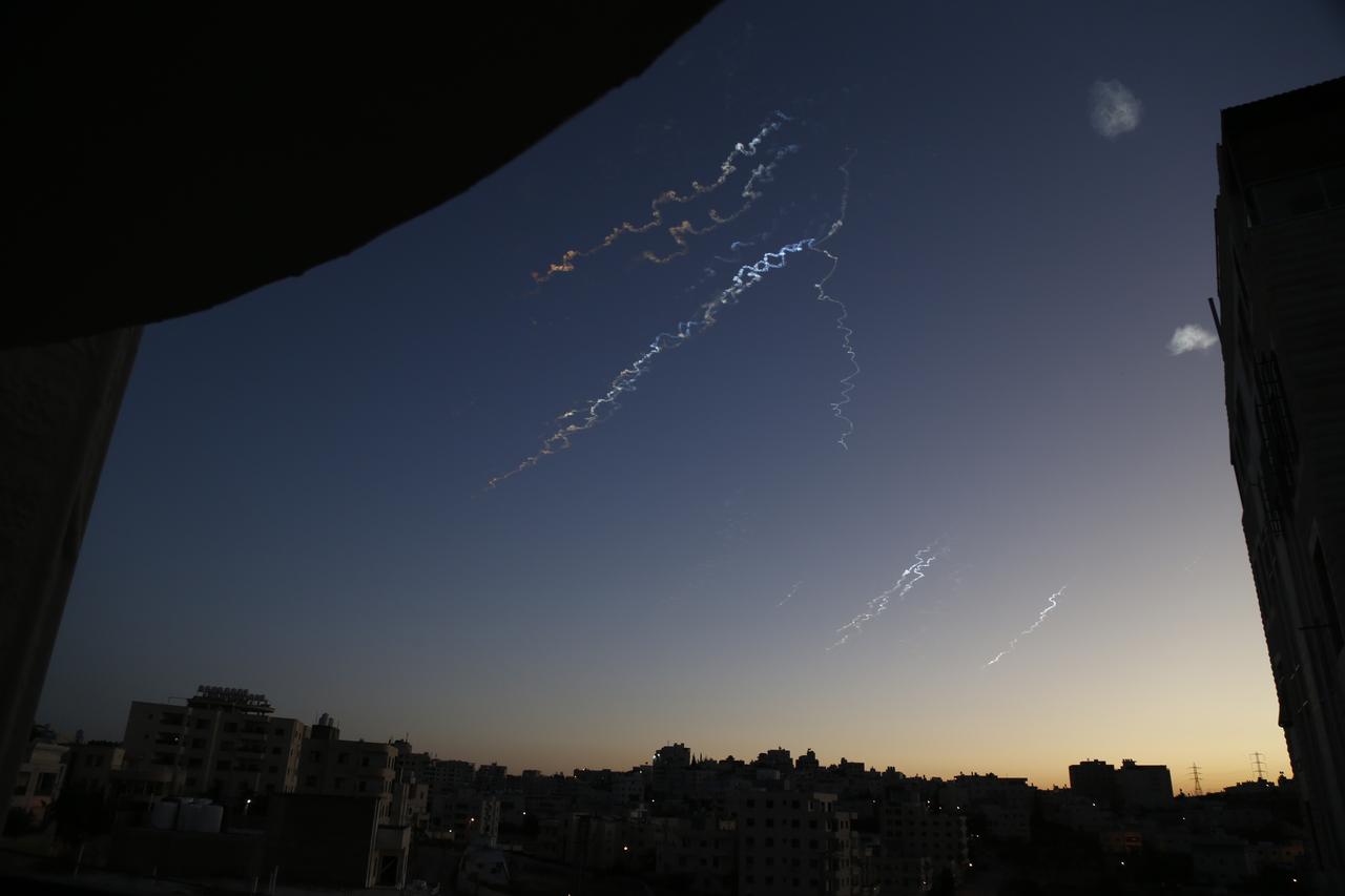 Trails of missiles and interceptor fire from Israel’s Iron Dome defense system are seen in the early morning sky above Hebron on June 14, 2025. (AA Photo)