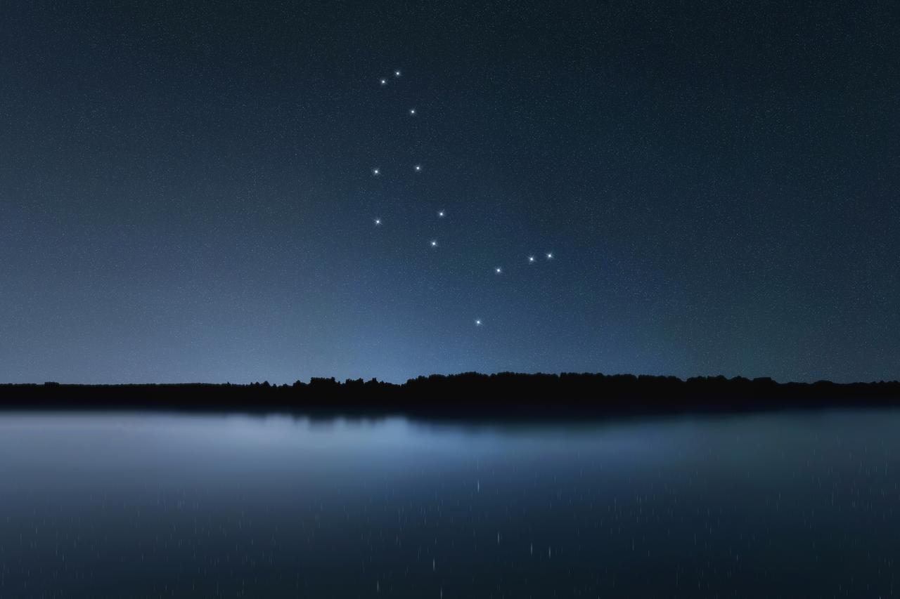The Boötes constellation appears above the horizon in a clear night sky over a calm lake, accessed Jun. 27, 2025. (Adobe Stock Photo)