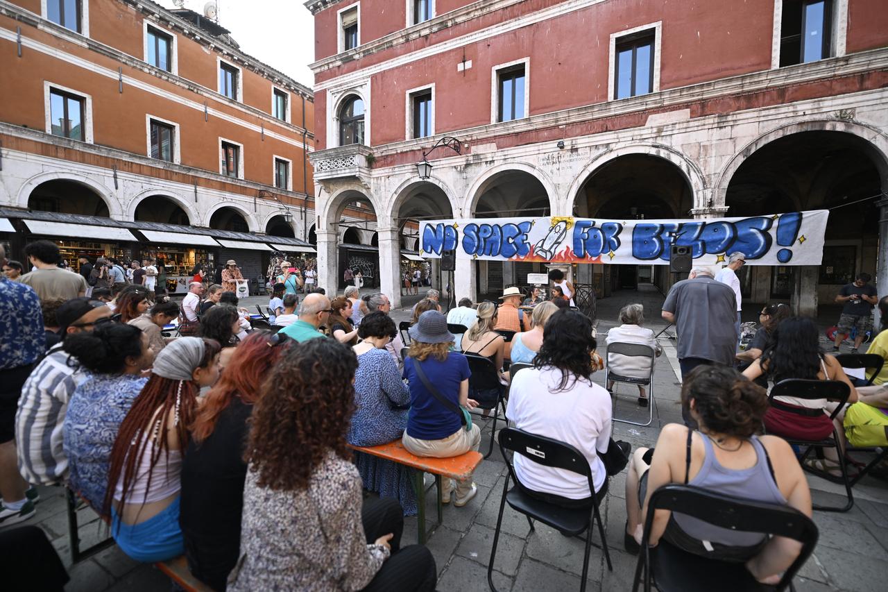 People gather to protest against the wedding of Amazon Founder and CEO Jeff Bezos and journalist Lauren Sanchez in Venice, Italy, on June 13, 2025. (AFP Photo)