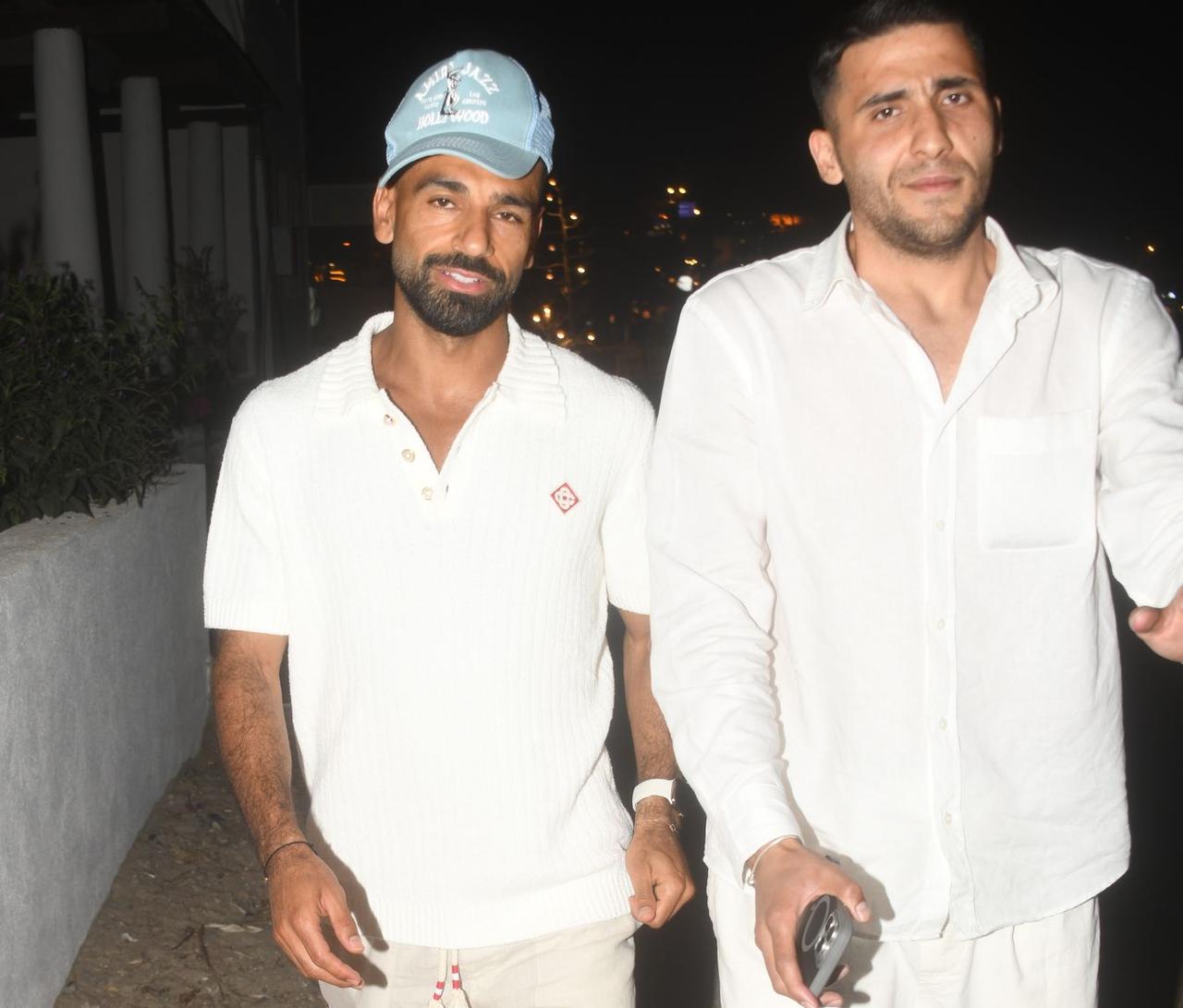 Famous footballer Mohamed Salah (L) was photographed by journalists as he left a seafood restaurant in Bodrum, Mugla, Türkiye, June 26, 2025. (Photo via Haberturk)