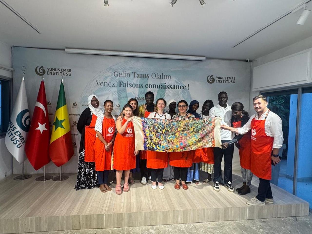 Participants explore the art of ebru during a workshop led by Turkish artist Eda Ozbekkangay at the Yunus Emre Institute in Dakar, Senegal, June 26, 2025. (AA Photo)
