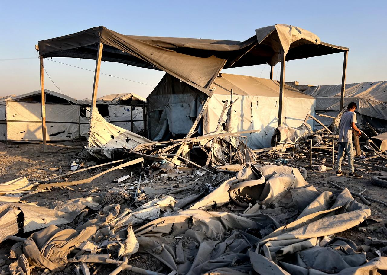 Residents gather after the Israeli army targets a house belonging to the al-Sus family in the Bureij refugee camp in the central Gaza Strip on June 27, 2025. (AA Photo)