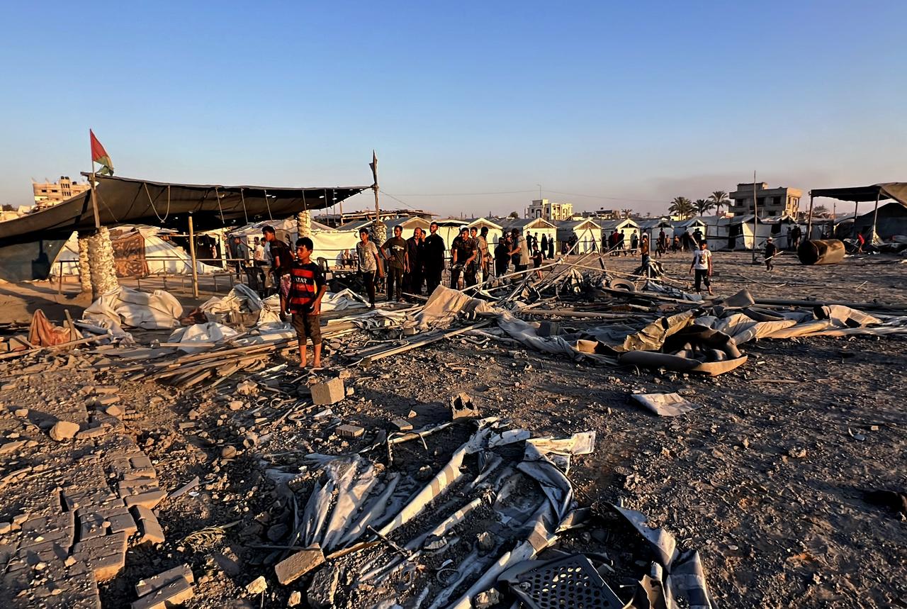 Residents gather after the Israeli army targets a house belonging to the al-Sus family in the Bureij refugee camp in the central Gaza Strip on June 27, 2025. (AA Photo)