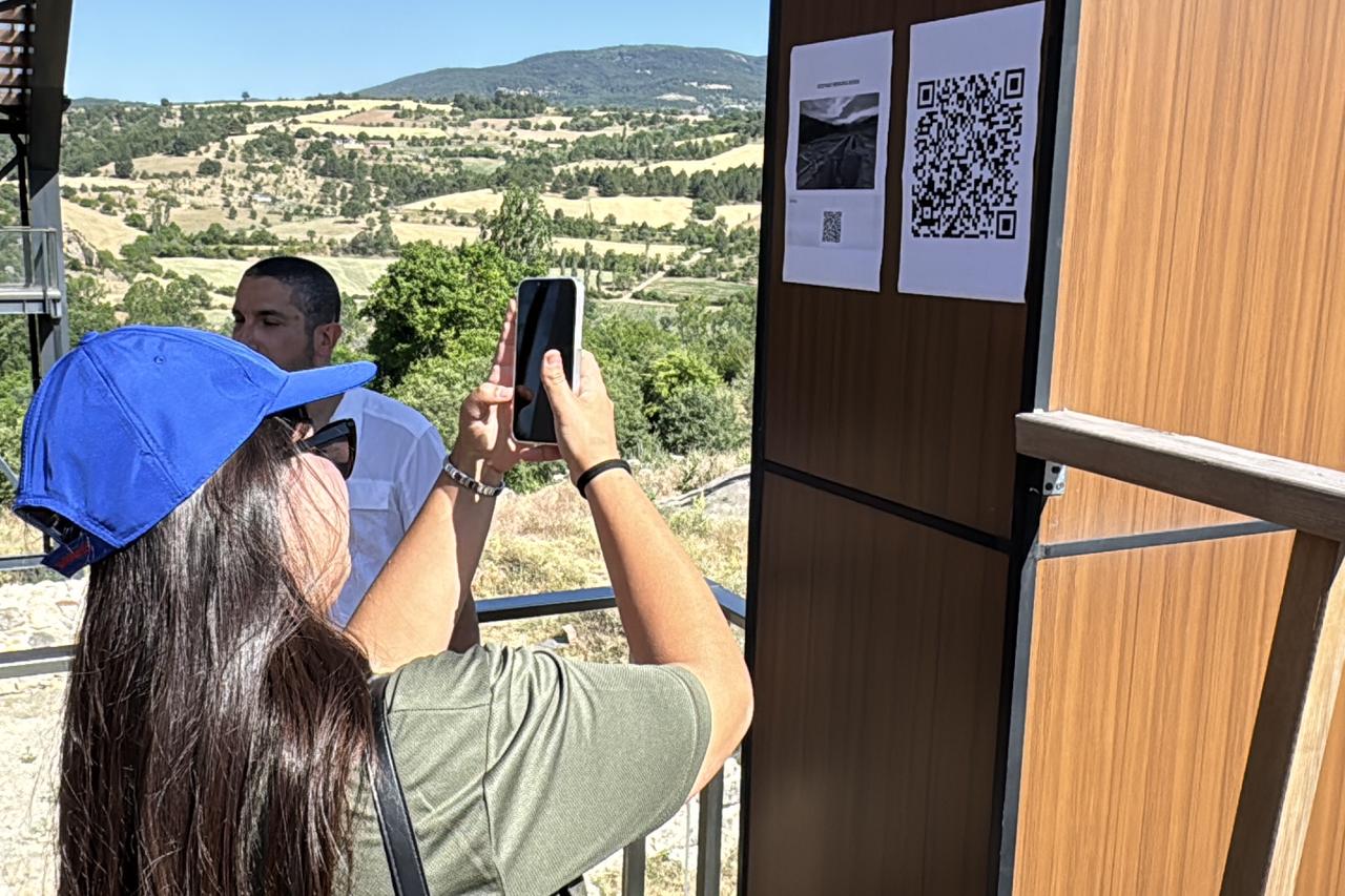 While scanning the QR codes placed at visitor points in the ancient city of Hadrianopolis in Karabuk, Türkiye, users are directed to a question-and-answer interface powered by an advanced language model, June 27, 2025. (AA Photo)