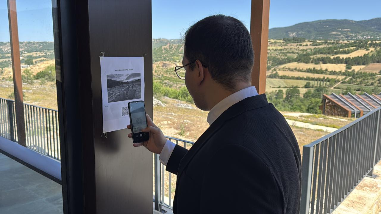 While scanning the QR codes placed at visitor points in the ancient city of Hadrianopolis in Karabuk, Türkiye, users are directed to a question-and-answer interface powered by an advanced language model, June 27, 2025. (AA Photo)
