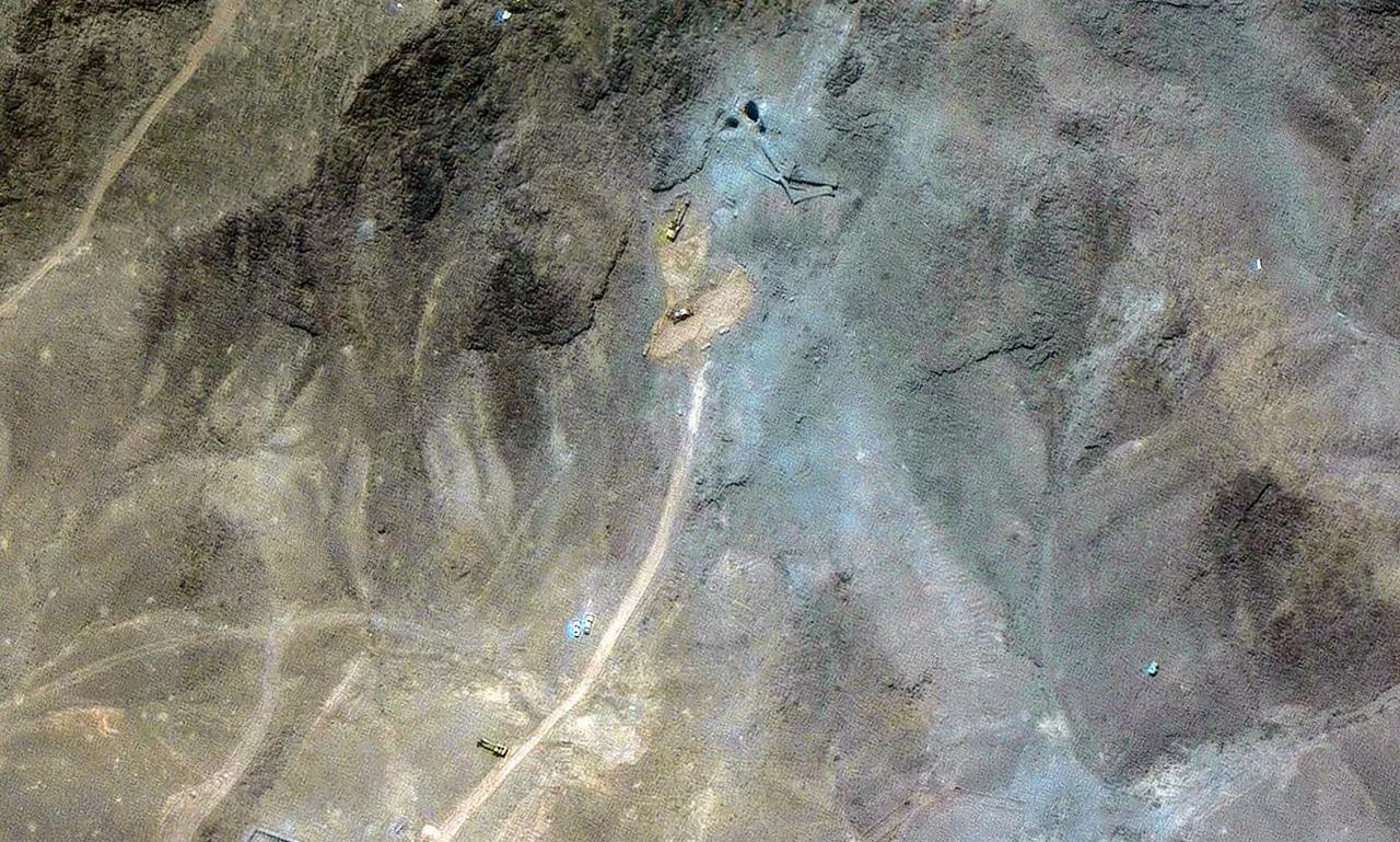 Close-up showing excavators near the northern entrances to Fordow's underground complex. (Photo via Maxar Technologies)