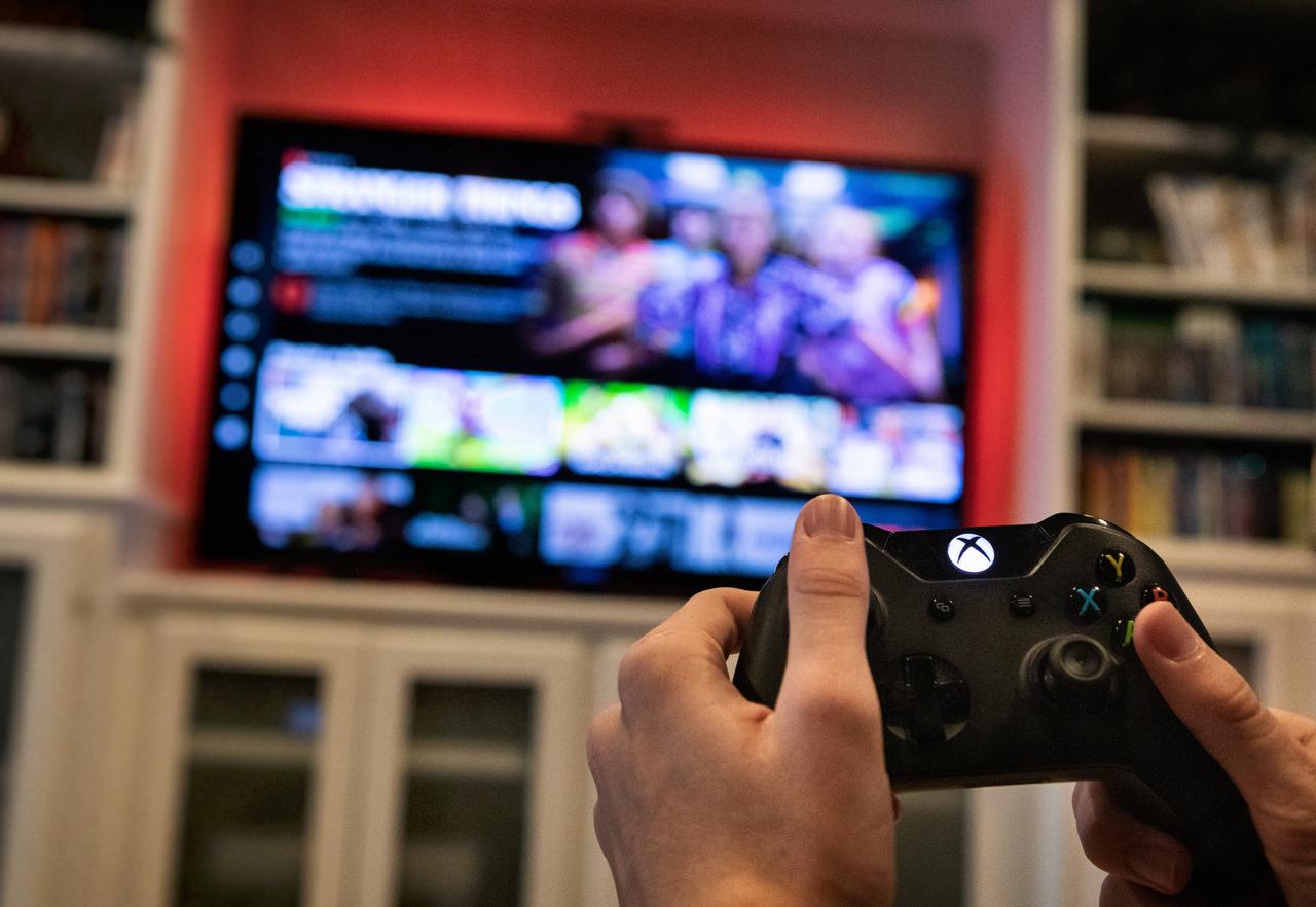 Viewer loading Stranger Things TV series on Xbox system on St. Louis, Missouri, US in August 17, 2019. (Adobe Stock Photo)