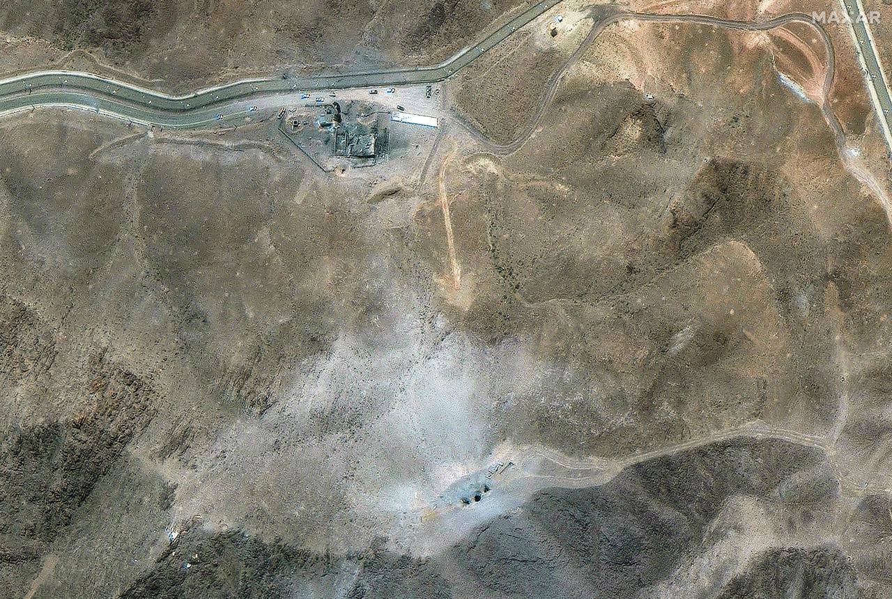 This handout satellite image provided by Maxar Technologies and dated June 27, 2025, shows vehicles at the Fordow Fuel Enrichment Plant (FFEP) one week after US strikes on three Iranian nuclear sites early on June 22. (Photo by Satellite image ©2025 Maxar Technologies / AFP)