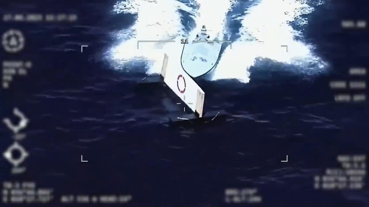 Screenshot from a video of a joint test of Baykar's Bayraktar TB3 UAV and MKE's PIRANA kamikaze unmanned surface vehicle (KUSV) on June 28, 2025. (Photo via X/@BaykarTech)