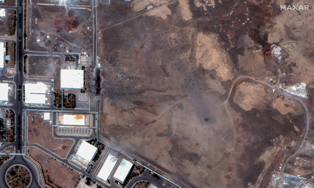 This handout satellite picture provided by Maxar Technologies shows airstrike craters over underground centrifuge halls in Natanz nuclear enrichment facility in central Iran on June 22, 2025. (Photo by Satellite image ©2025 Maxar Technologies / AFP)