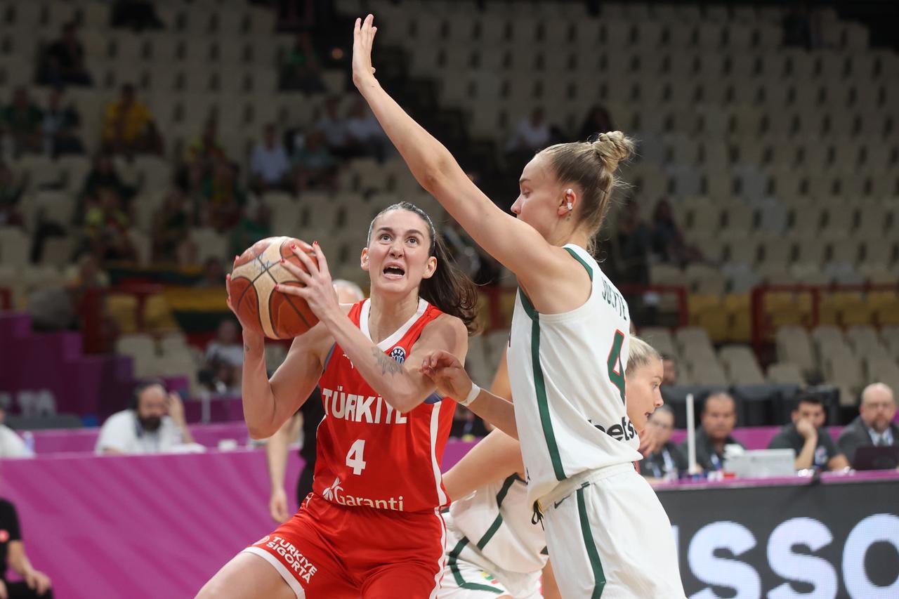 Olcay Cakir (L) of Turkiye in action against Juste Jocyte (R) of Lithuania during the classification game for 7th place of the 2025 FIBA Women’s EuroBasket at Peace and Friendship Stadium in Piraeus, Greece on June 29, 2025. (AA Photo)