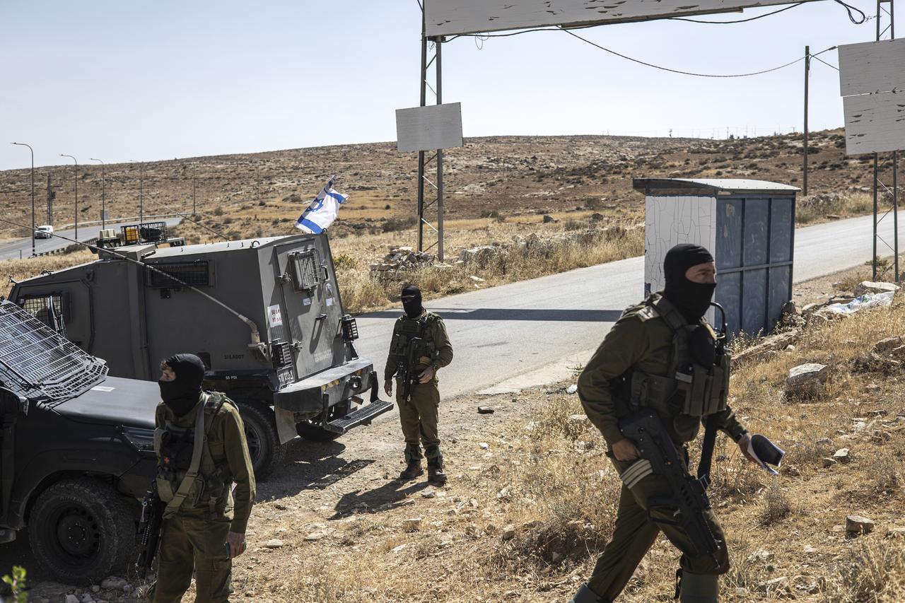 Israeli security forces block the entrance to the village of al-Tuwani in the Masafer Yatta area in Occupied West Bank on June 2, 2025. (Photo by JOHN WESSELS / AFP)