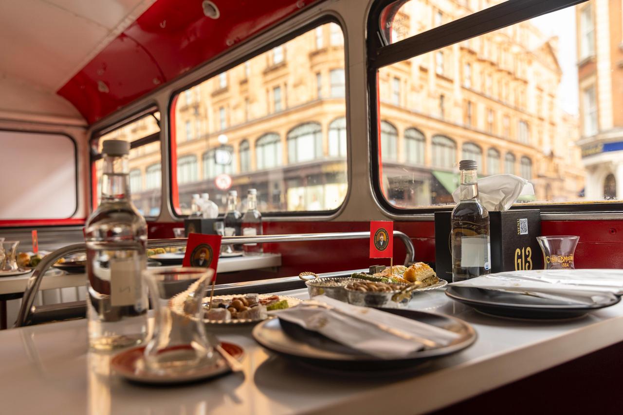 A traditional red London bus has been transformed into a mobile Turkish tea room as part of a cultural initiative by historic Turkish confectionery brand Hafiz Mustafa 1864, England, June 3, 2025. (AA Photo)