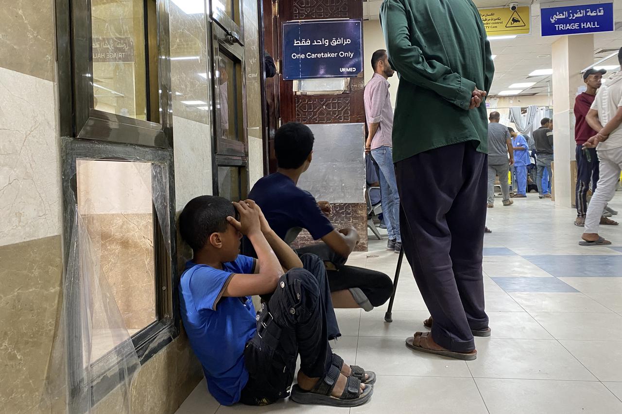 A Palestinian youth cries as he waits for news on a relative injured in Israeli strikes in Khan Yunis, at the Nasser hospital in the southern Gaza Strip on June 3, 2025. (Photo by AFP)