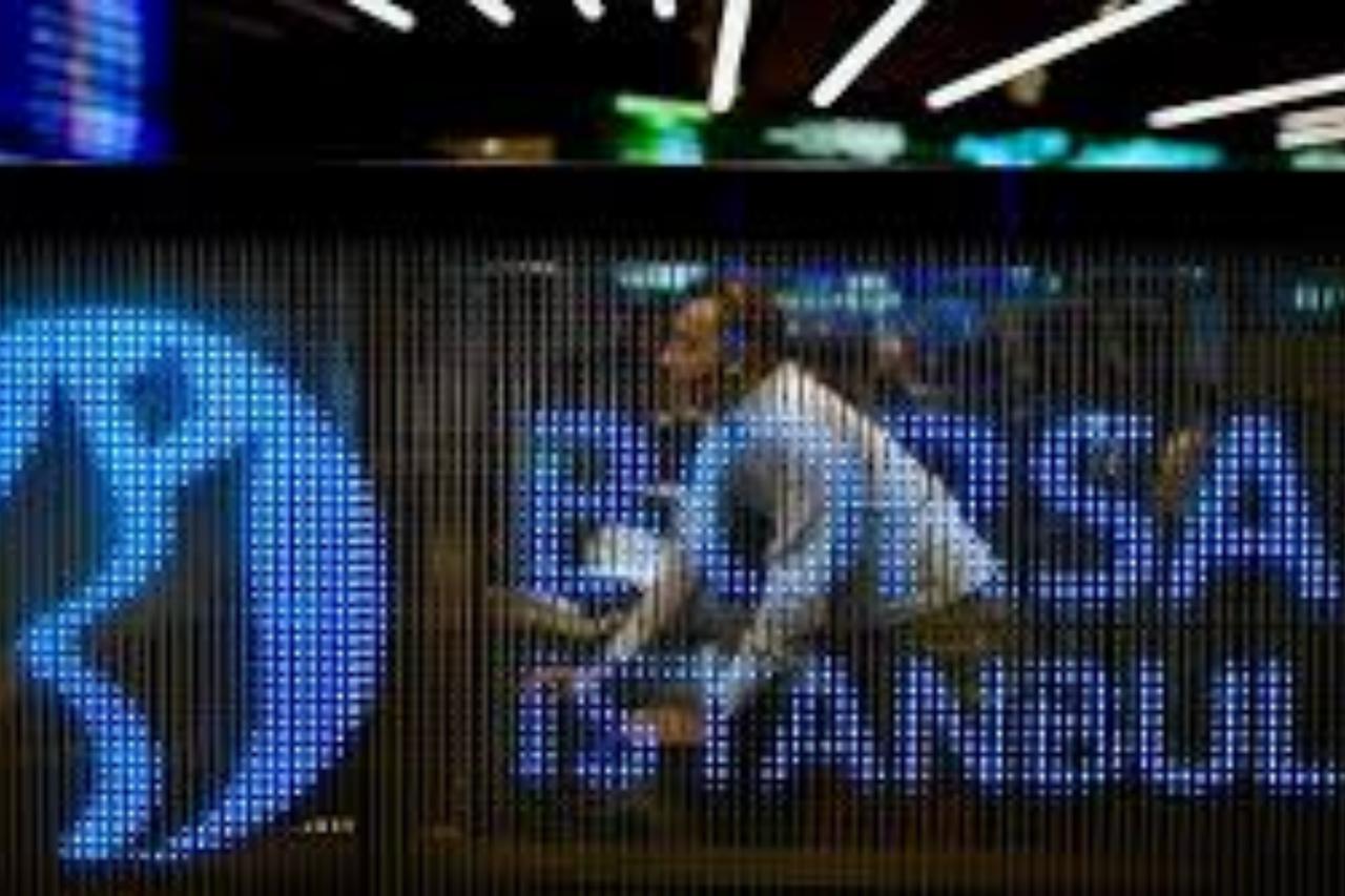 A trader is seen behind an illuminated Borsa Istanbul display panel at the stock exchange’s trading floor in Istanbul, Türkiye, accessed on June 30, 2025. (AA Photo)