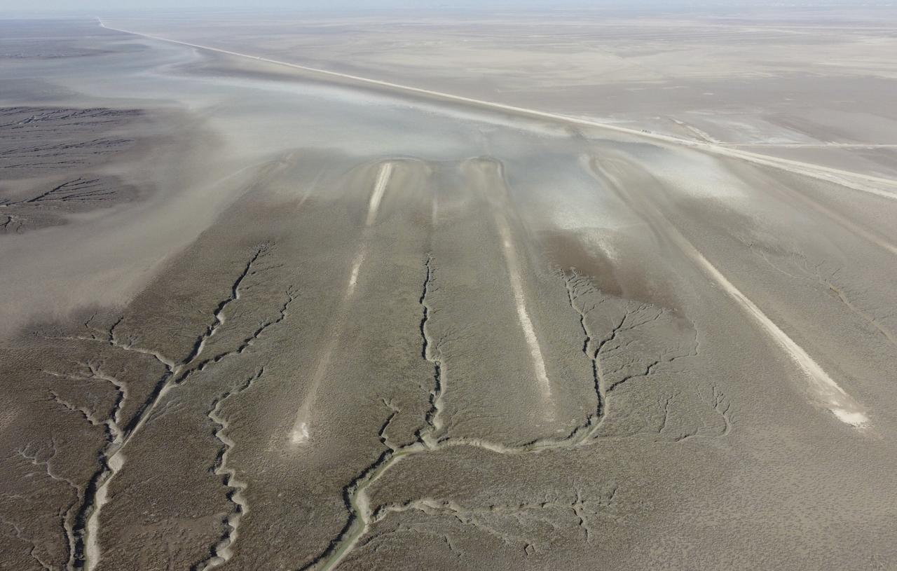 An aerial photo shows an archaeological site where researchers uncovered massive earthen structures, believed to have been built with slave labor, and found that their construction spanned several centuries, near Basra, Iraq, Saturday, Jan. 29, 2022. (Photo via Jaafar Jotheri)