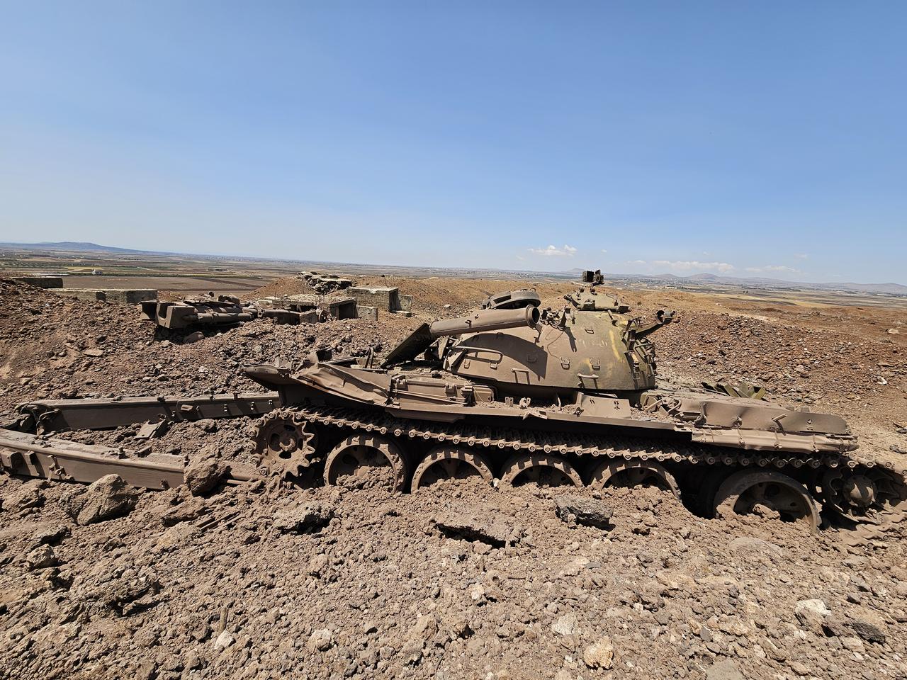 A view of damaged Syrian army tanks and other heavy weapons is seen in the Yarmouk area, after Israeli artillery fire hit the area in response to rockets allegedly launched into Daraa, Syria, on June 04, 2025. (AA Photo)