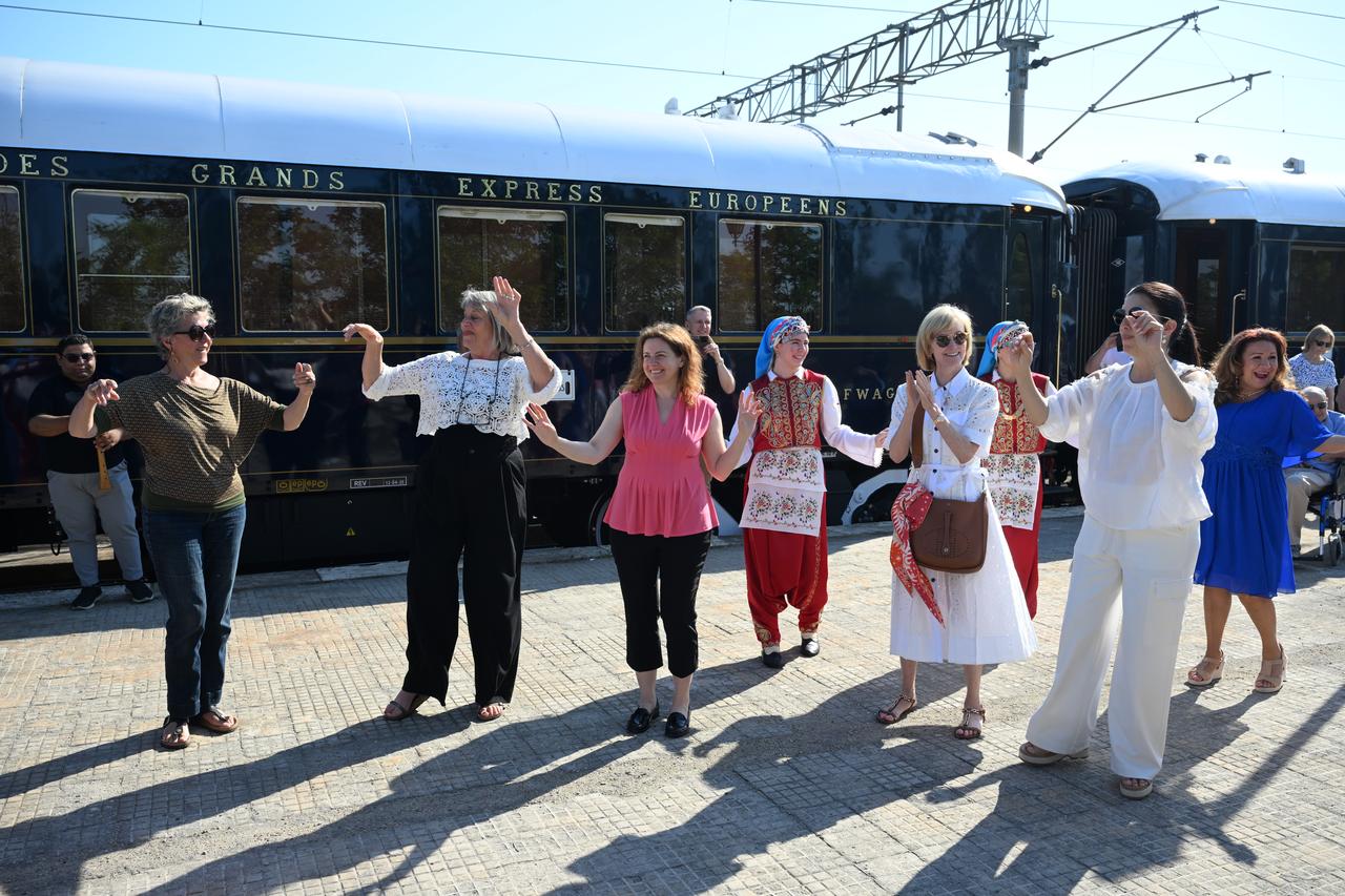 The passengers danced with the folk dancers who welcomed them, on June 4, 2025. (AA Photo)