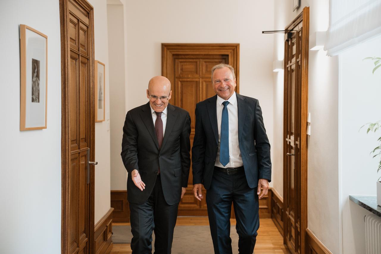 Turkish Finance Minister Mehmet Simsek walks with Luxembourg Finance Minister Gilles Roth following their bilateral meeting in Luxembourg, on June 4, 2025. (Photo via X/@RothGilles)