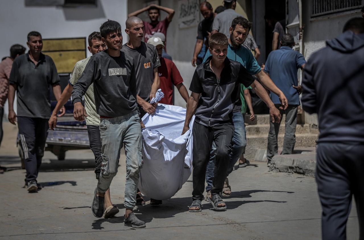 A Palestinian's body is brought to Shifa Hospital after Israeli airstrike in Gaza Strip on June 05, 2025. (AA Photo)
