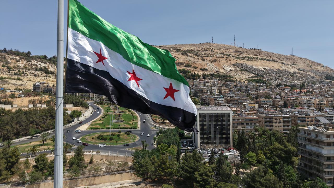 The largest Syrian flag of 600 square meters is hoisted on the tallest pole, 110 meters high, in Tishreen Park of the Syrian capital Damascus on June 4, 2025. (AA Photo)
