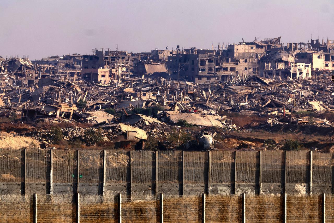 This picture, taken from the Israeli border with the Gaza Strip, shows destroyed buildings in the besieged Palestinian territory on June 5, 2025, amid the ongoing war between Israel and the Palestinian militant movement Hamas. Gazas civil defence agency said Israeli strikes killed at least 10 people in the battered Palestinian territory on June 5 as the military keeps up an intensified offensive. (Photo by Jack GUEZ / AFP)