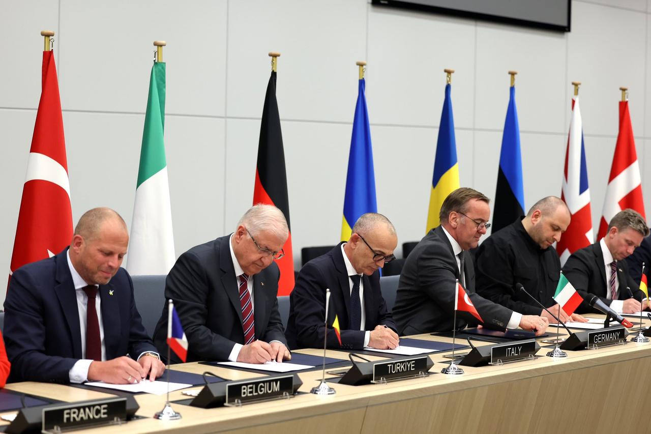 BRUSSELS, BELGIUM - JUNE 4: (----EDITORIAL USE ONLY MANDATORY CREDIT - TURKISH MINISTRY OF NATIONAL DEFENSE / HANDOUT - NO MARKETING NO ADVERTISING CAMPAIGNS - DISTRIBUTED AS A SERVICE TO CLIENTS----) Turkish Defense Minister Yasar Guler (2nd L) signs the Letter of Intent on behalf of Turkiye during the  Electromagnetic Warfare Coalition Letter of Intent Signing Ceremony  held as part of the NATO Defense Ministers Meeting in Brussels, Belgium on June 4, 2025. ( Turkish Defense Ministry/Handout - Anadolu Agency )