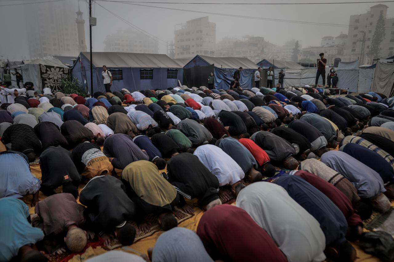 Displaced Palestinians living in makeshift tents of Al-Katiba neighbourhood gather to perform Eid al-Adha prayers in Gaza City, Gaza, June 6, 2025. (AA Photo)