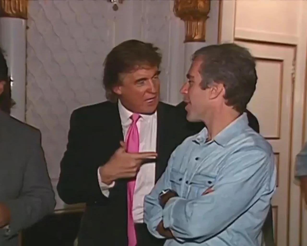 Then-businessman Donald Trump speaks with Jeffrey Epstein at a party in Palm Beach, Florida, in November 1992. (Photo via MSNBC)