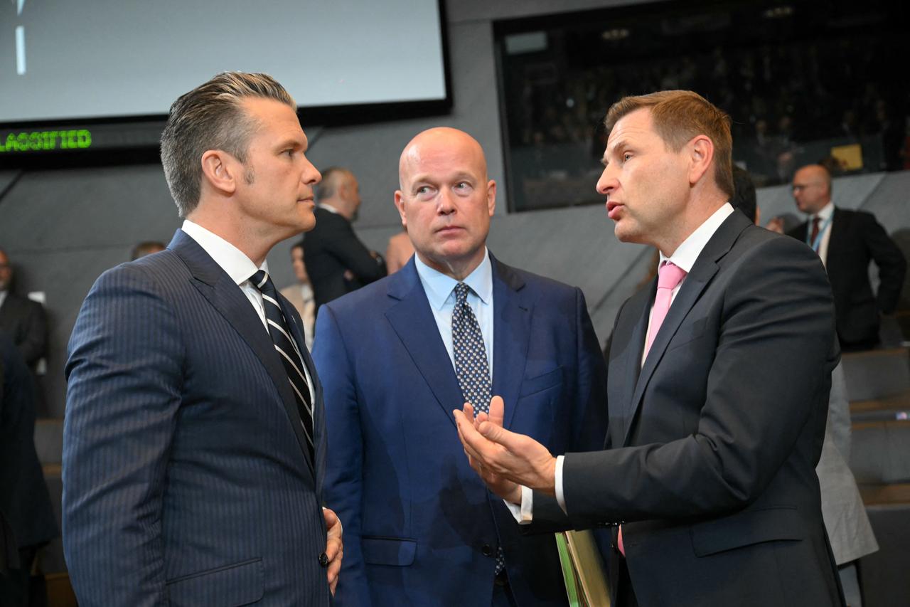 US Secretary of Defence Pete Hegseth (L) talks with Estonias Defence Minister Hanno Pevkur (R) and US Ambassador to NATO Matthew Whitaker as they arrives for a NATO Defence Ministers meeting at the NATO headquarters, in Brussels, on June 5, 2025. (Photo by NICOLAS TUCAT / AFP)