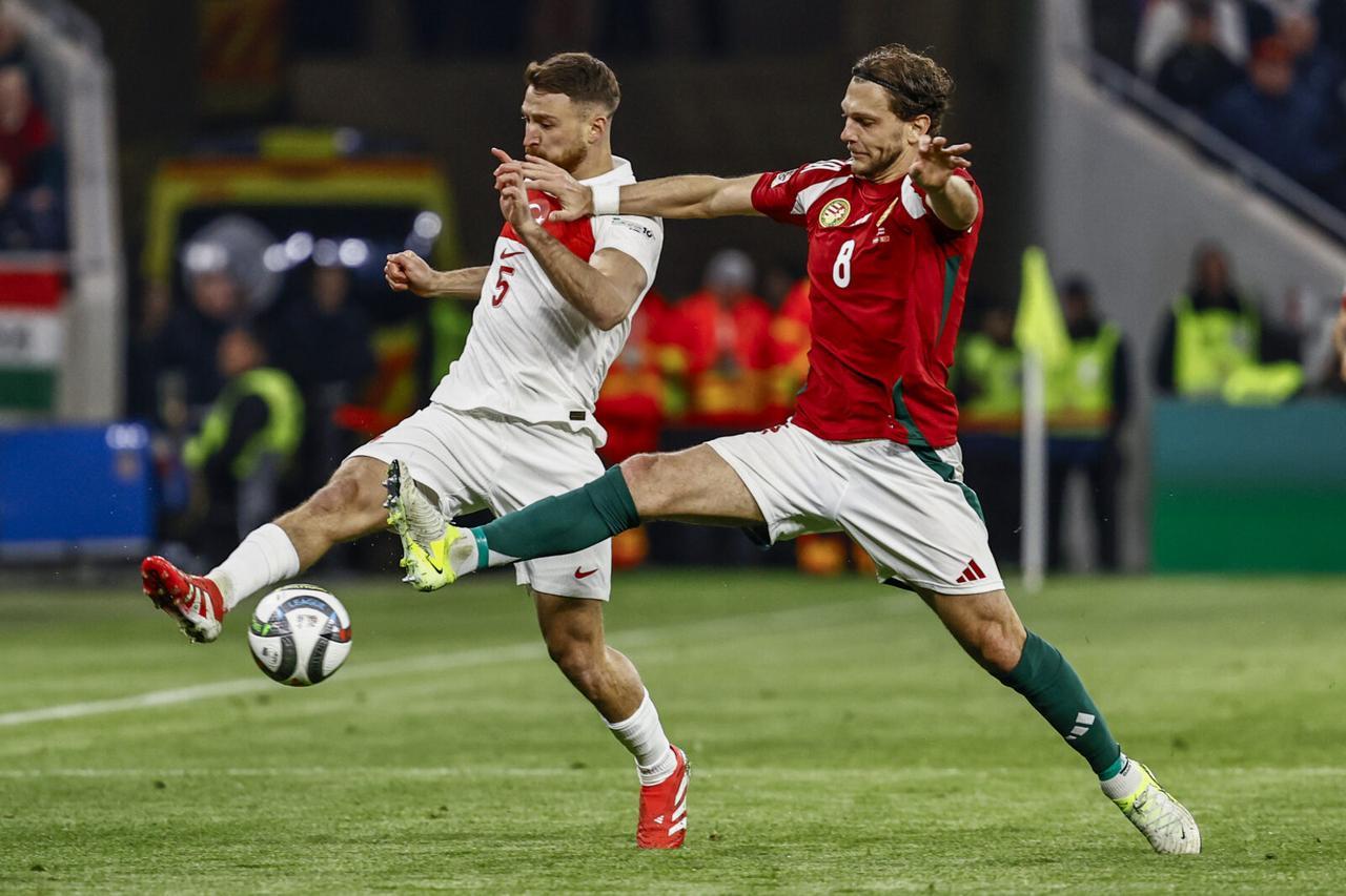 Salih Ozcan (5) of Turkiye in action against Balint Vecsei (8) of Hungary during the UEFA Nations League A/B play-off second leg match between Hungary and Turkiye at Puskas Arena in Budapest, Hungary on March 23, 2025. (AA Photo)