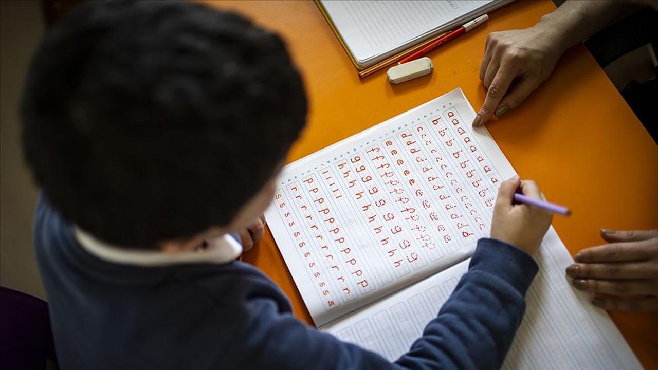 A child practices reading and writing in a classroom in Türkiye, accessed on June 7, 2025. (AA Photo)
