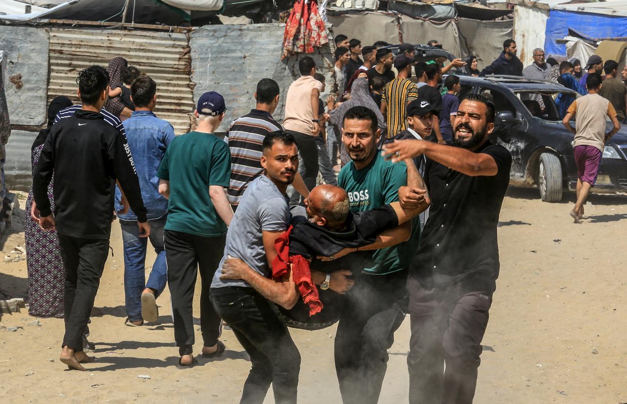 Displaced Palestinians mourn and carry injured and killed Palestinians who lost their lives after Israeli airstrike and artillery shelling on Eid al-Adha morning in Khan Yunis, Gaza on June 06, 2025. (AA Photo)