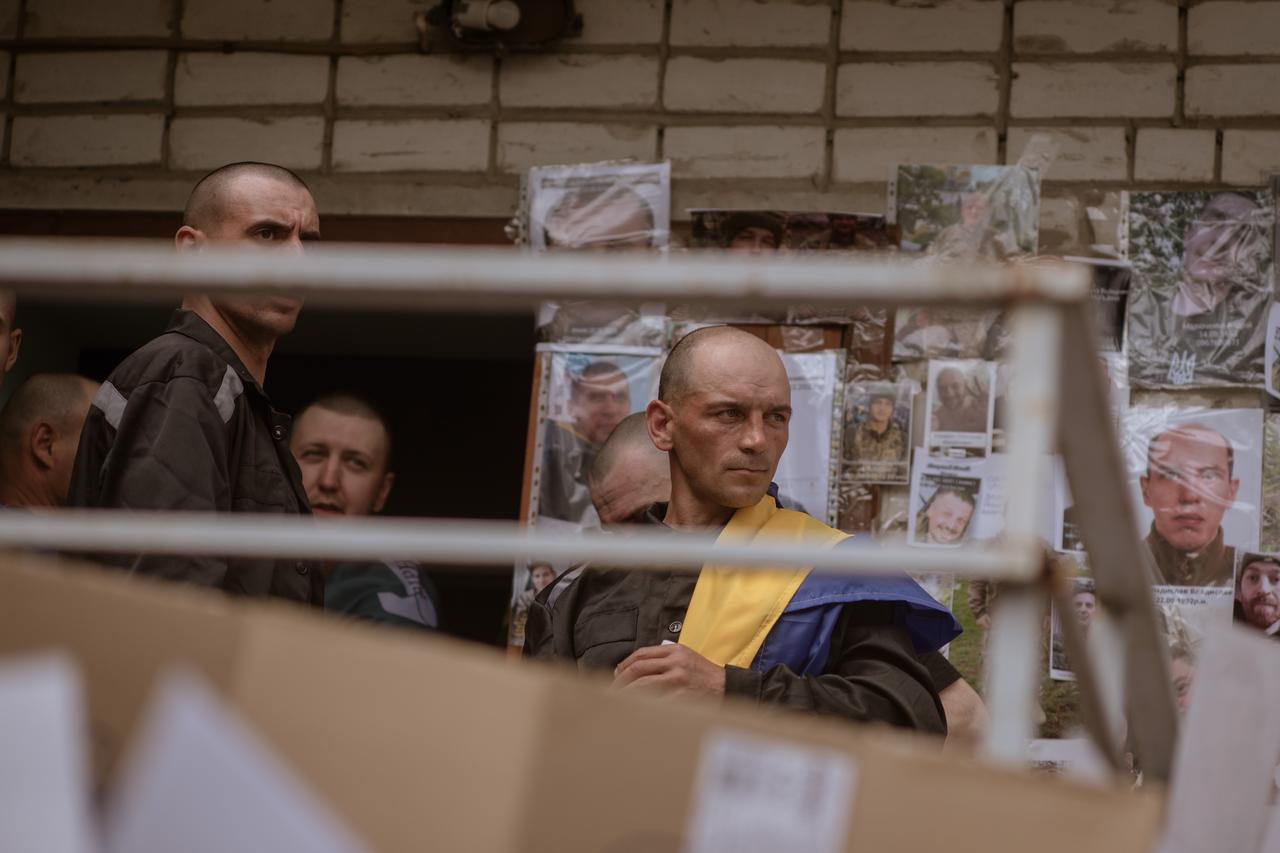 UKRAINE - MAY 25: Recently released Ukrainian prisoners of war are seen after being freed as part of the third and final round of the large-scale “1,000-for-1,000” prisoner swap between Ukraine and Russia, in North Ukraine, on May 25, 2025. A total of 303 Ukrainian defenders were released from Russian captivity as part of the swap, which was facilitated by TUrkiye earlier in May. The released servicemen include members of various branches of the Ukrainian Armed Forces, including 70 defenders of Mariupol. Since the start of Russia’s full-scale invasion in 2022, 65 exchanges have taken place, with 5,757 Ukrainians freed. The three-day exchange operation, confirmed by both Moscow and Kyiv, brought renewed hope to families still awaiting news of the missing. ( Andre Luis Alves - Anadolu Agency )