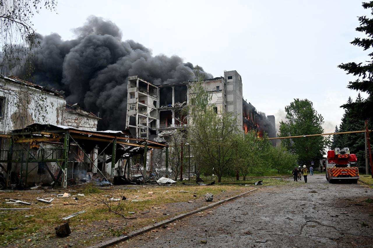 Firefighters extinguish a fire at a civilian plant following Russian powerful attacks to Ukrainian city of Kharkiv early on June 7, 2025. (AFP Photo)