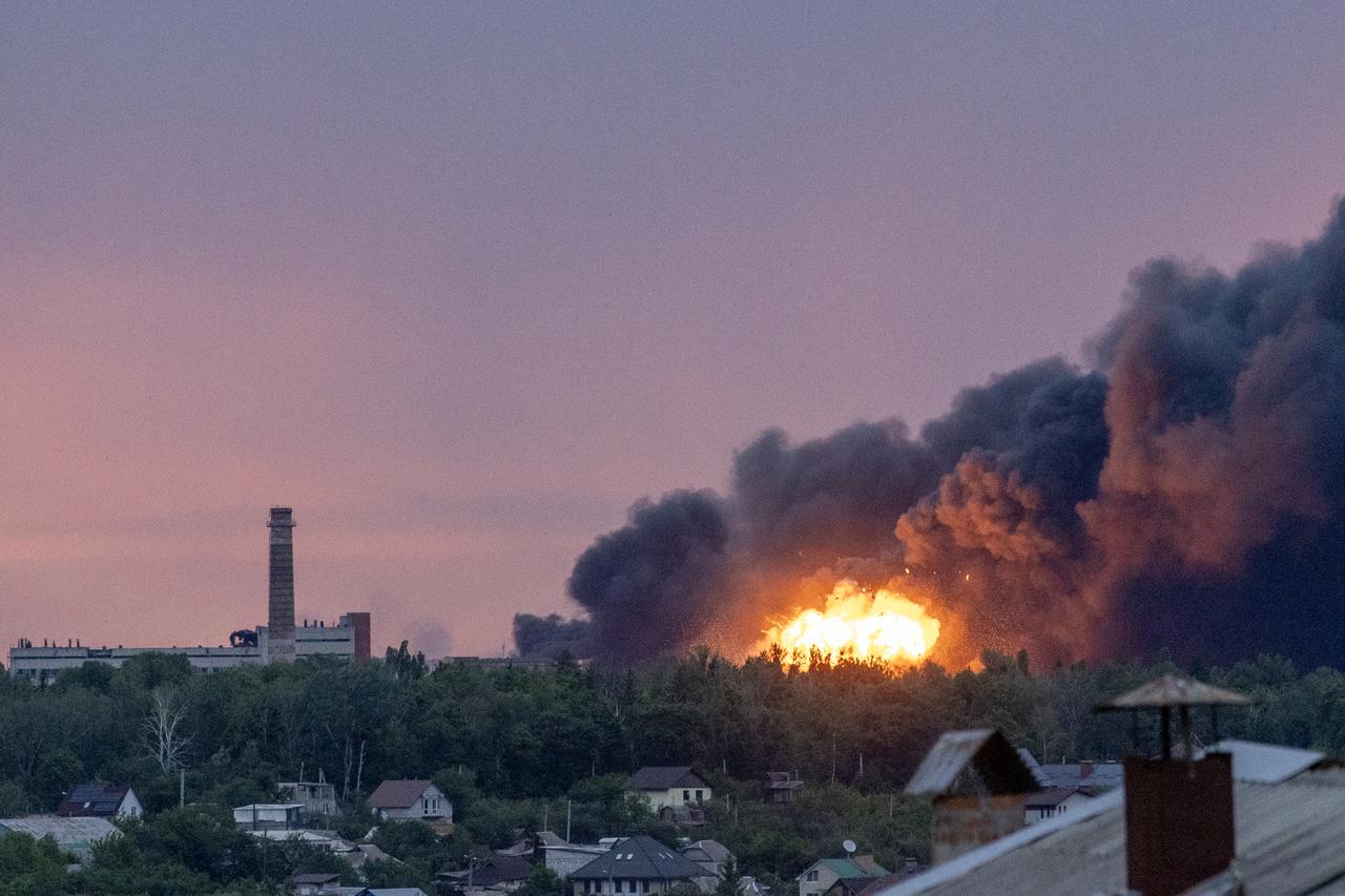 KHARKIV, UKRAINE - JUNE 7: Fire is seen among the smoke clouds billowing from a Russian attack on Kharkiv, Ukraine on June 7, 2025. At least one person was killed and 17 others injured in the attack, Kharkiv Mayor Ihor Terekhov told RBC-Ukraine. RBC-Ukraine also reported more than explosions were heard during the attacks which lasted more than and hour and a half. ( Daniel Cardenas - Anadolu Agency )
