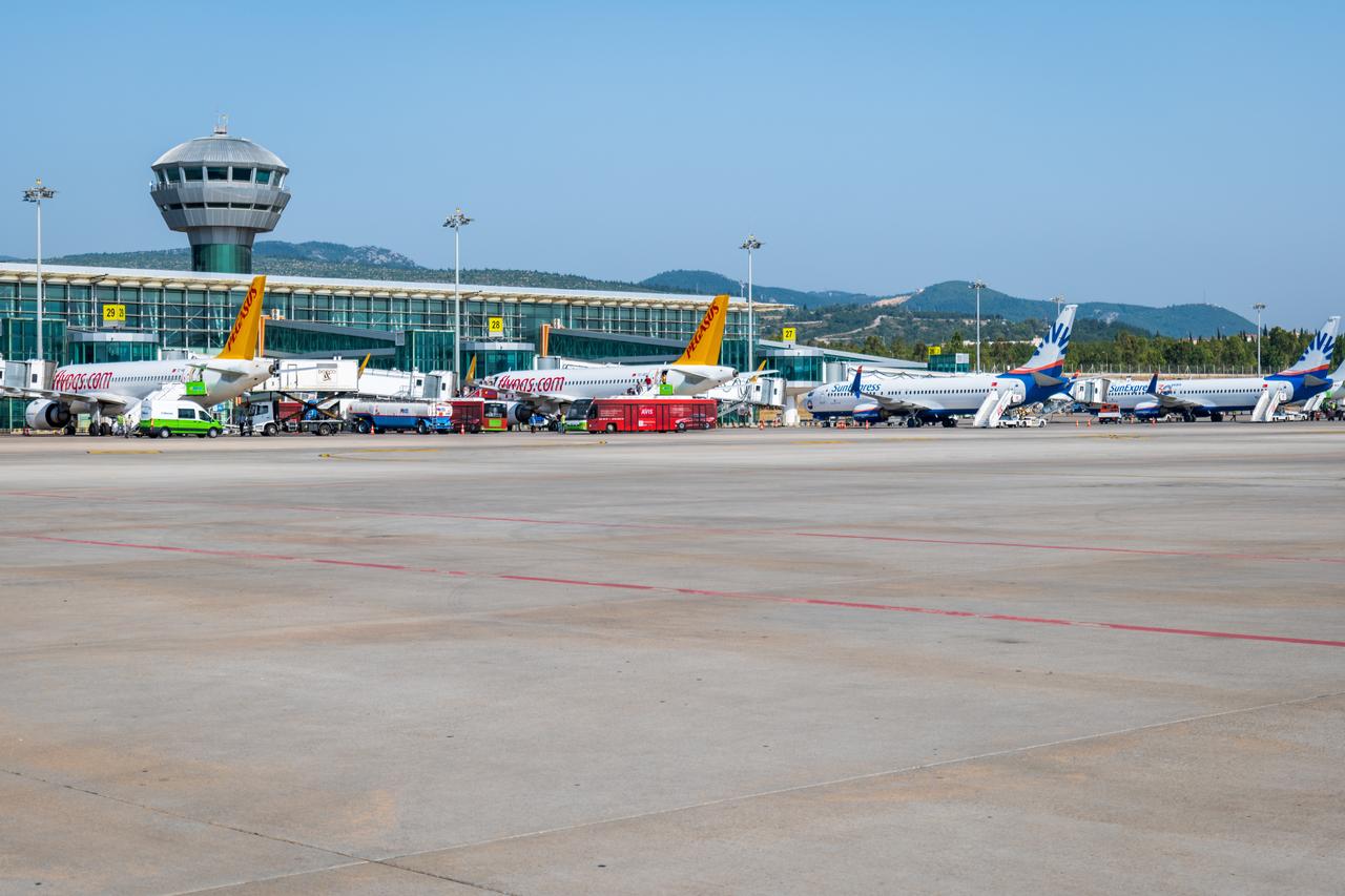 Aircraft from Pegasus Airlines and SunExpress line up at the departure gates of Izmir Adnan Menderes Airport in Türkiye, on June 3, 2022. (Adobe Stock Photo)