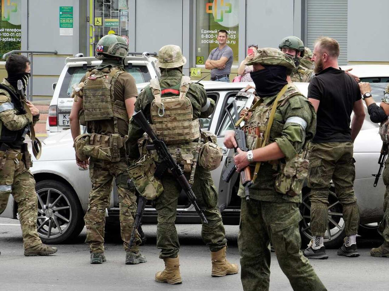 Members of Wagner group inspect a car in a street of Rostov-on-Don, on June 24, 2023. (AFP Photo)