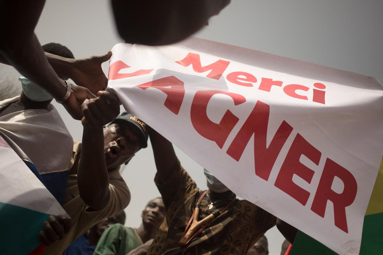 Protesters holds a banner reading  Thank you Wagner,  the name of the Russian private security firm present in Mali, during a demonstration to celebrate Frances announcement to withdraw French troops from Mali, in Bamako, on Feb. 19, 2022. (AFP Photo)