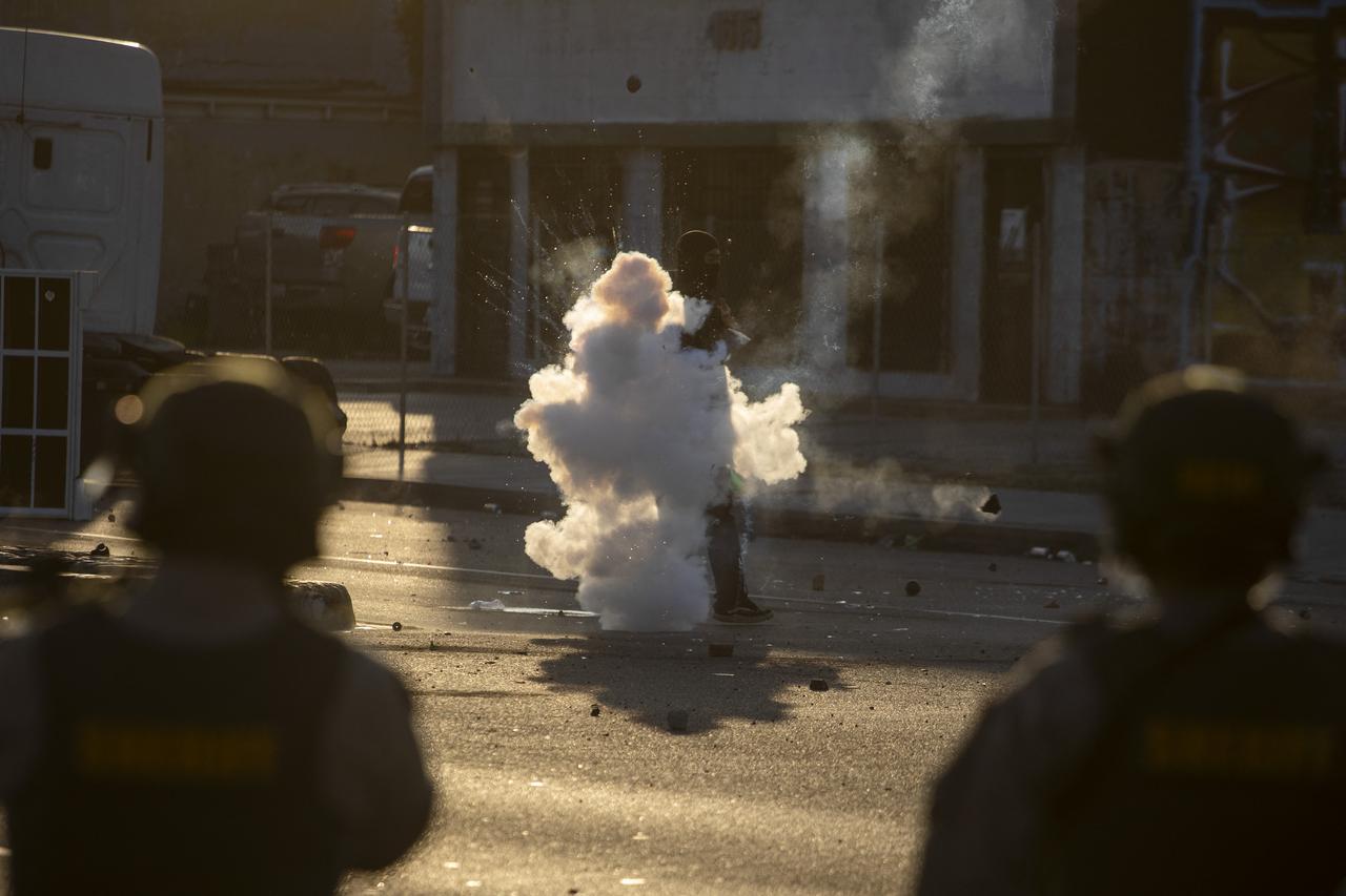 Law enforcement clashes with demonstrators during a protest following federal immigration operations, in the Compton neighborhood of Los Angeles, California on June 7, 2025. (AFP Photo)