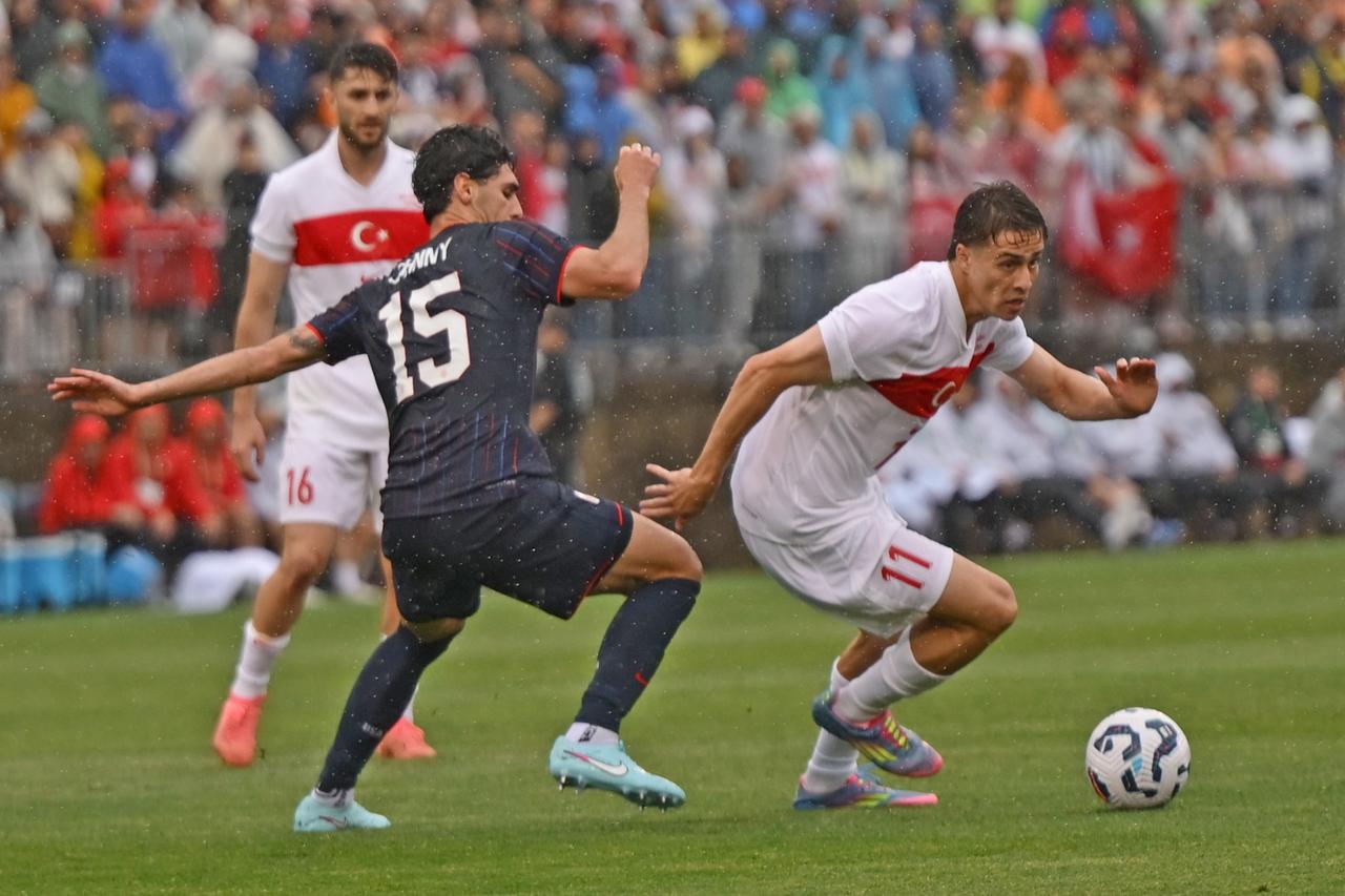 Kenan Yildiz (11) of Türkiye in action against Johnny Cardoso (15) of USA during the friendly match between Turkiye and USA at Pratt and Whitney Stadium at Rentschler Field in East Hartford, Connecticut, United States on June 7, 2025. (AA Photo)