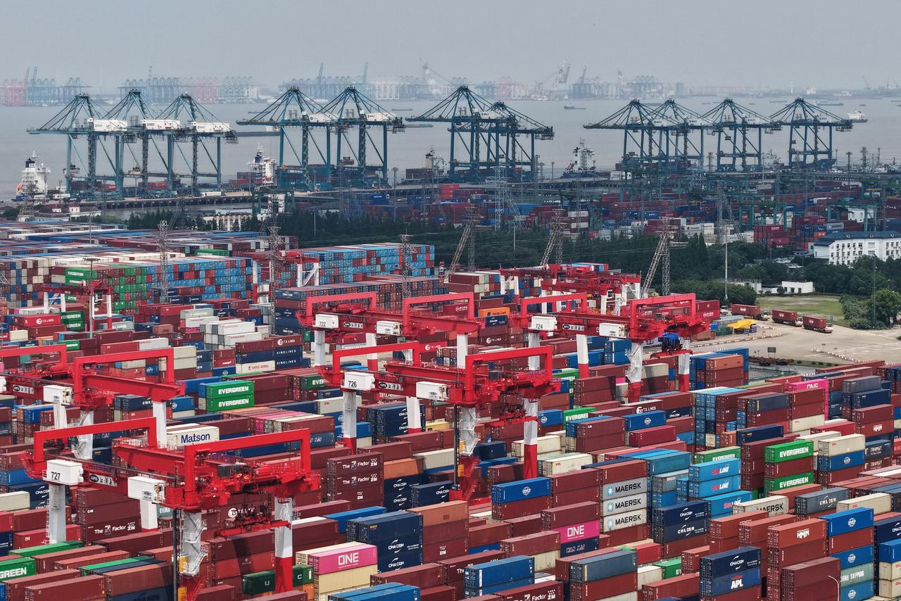 Shipping containers are stacked at a port in Shanghai on June 9, 2025. (AFP Photo)