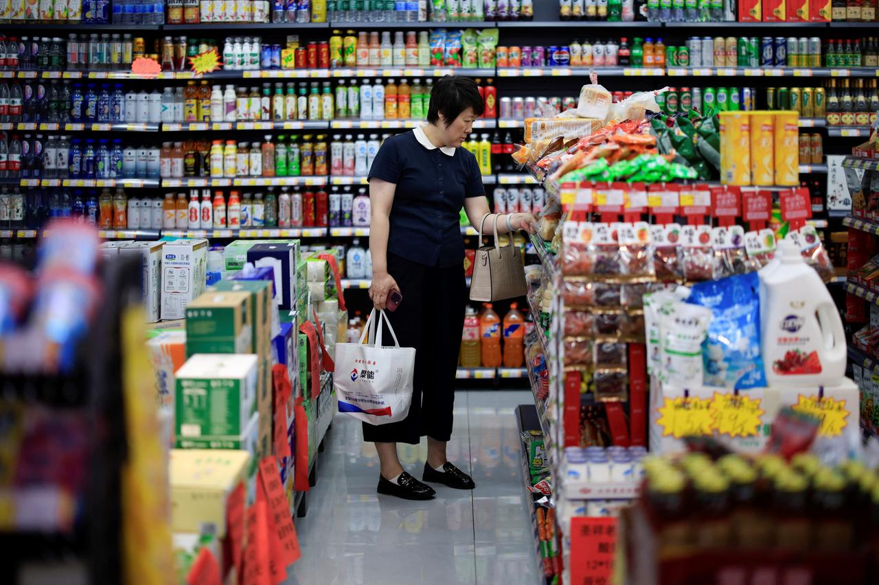 A woman shops at a market in Shenyang, in China’s northeast Liaoning province on June 9, 2025. (AFP Photo)